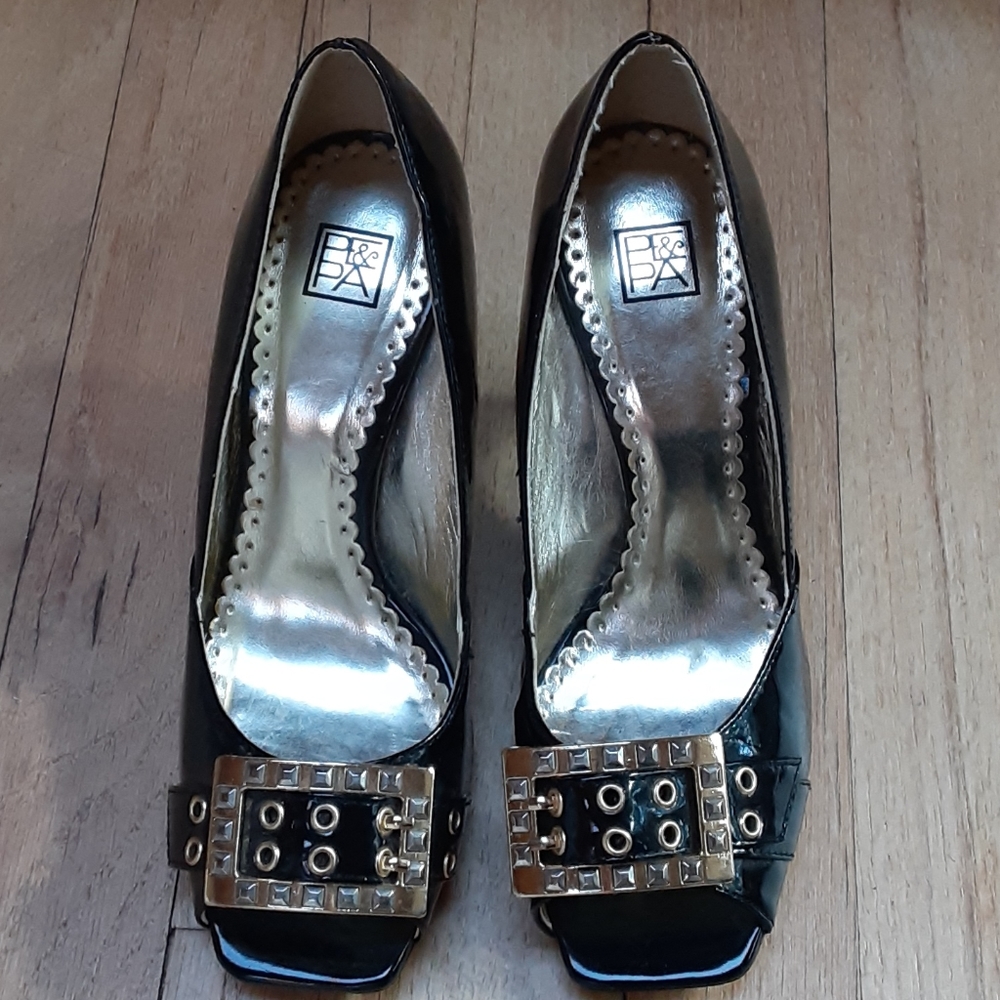 Black peep toe patent heels with gold buckles